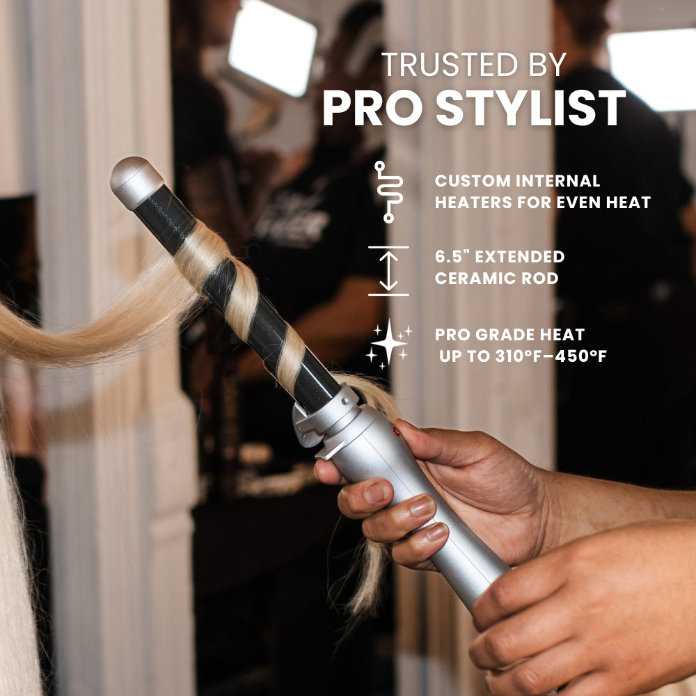 Hair styling tool with text highlighting features, held by a person in a salon setting.