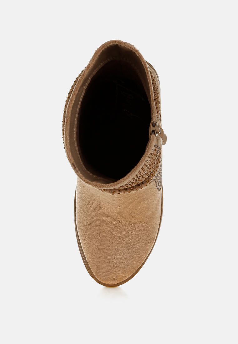 Tan ankle boot with woven detail on a white background