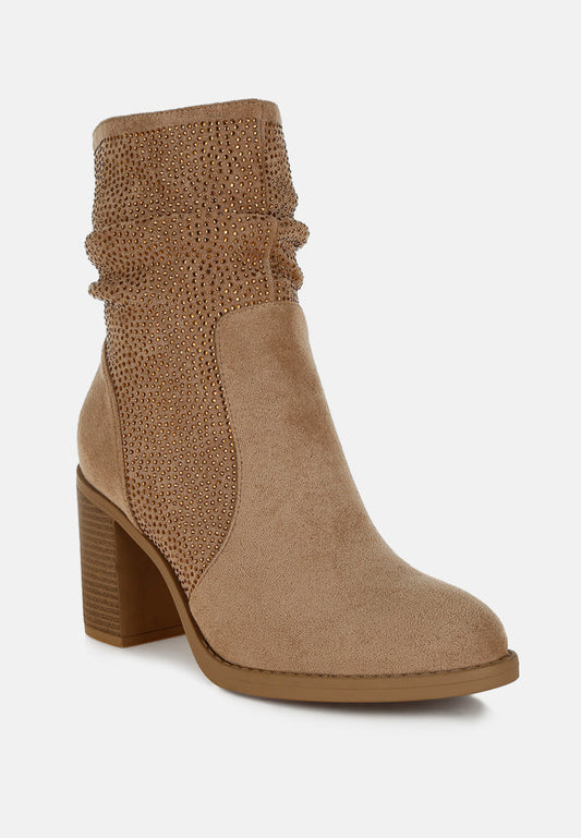 Tan ankle boot with textured design on a white background
