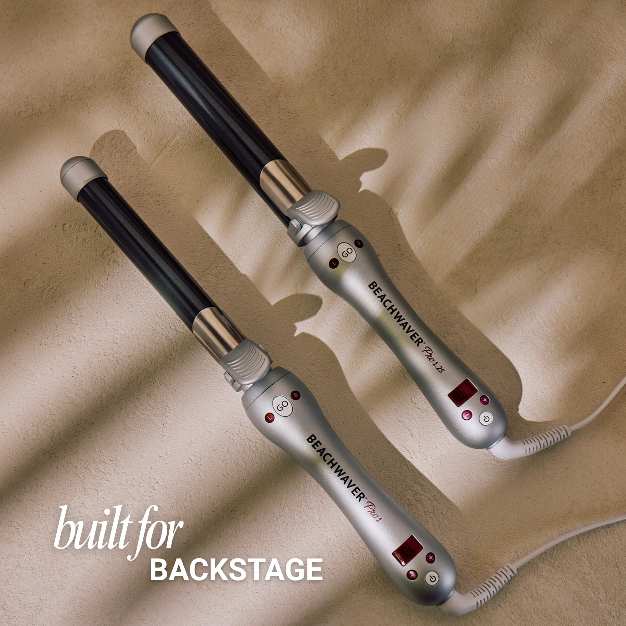 Two Beachwaver Pro curling irons on a beige background with 'built for BACKSTAGE' text.
