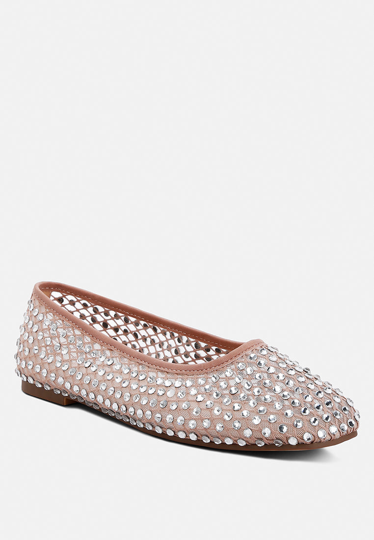 Pink flat shoe with rhinestone embellishments on a white background