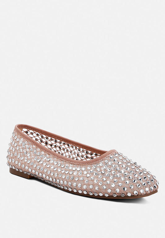 Pink flat shoe with rhinestone embellishments on a white background