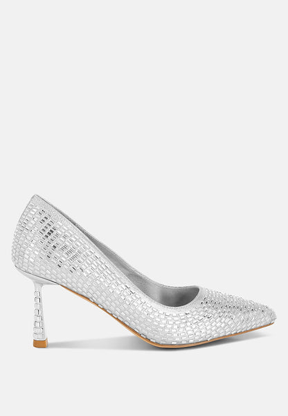 Silver high-heeled shoe with crystal embellishments on a white background