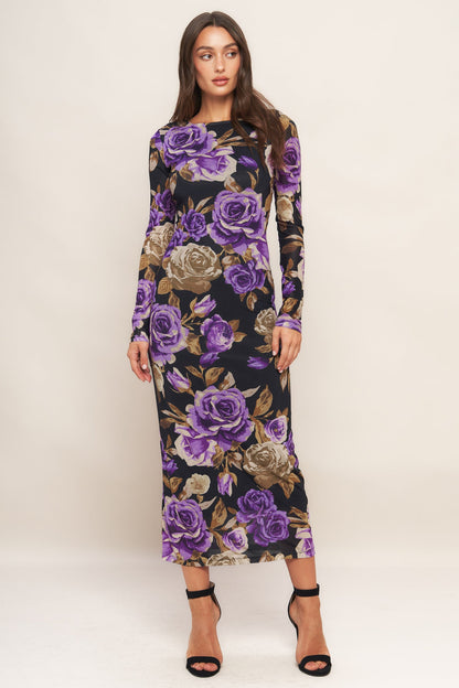 Woman wearing a floral dress with purple roses on a white background