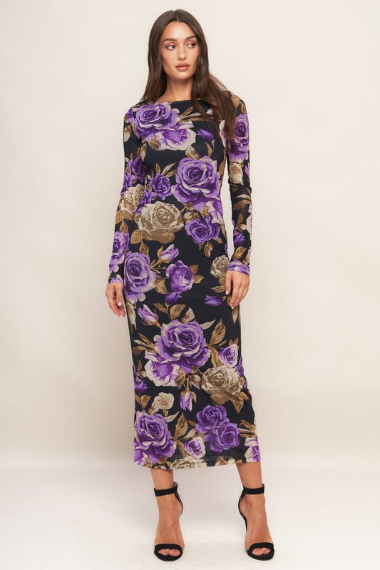 Woman wearing a floral dress with purple roses on a white background