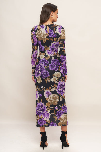 Woman wearing a floral dress with purple flowers on a white background